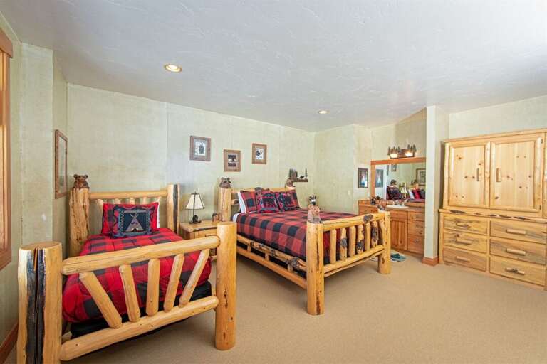 This ground floor bedroom offers queen bed, twin bed & twin trundle | Lower Level This ground floor bedroom offers queen bed, twin bed & twin trundle | Lower Level