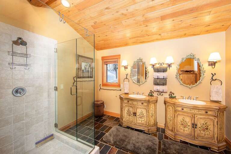 The master ensuite features double vanities & luxurious walk-in glass shower | Upper Level The master ensuite features double vanities & luxurious walk-in glass shower | Upper Level