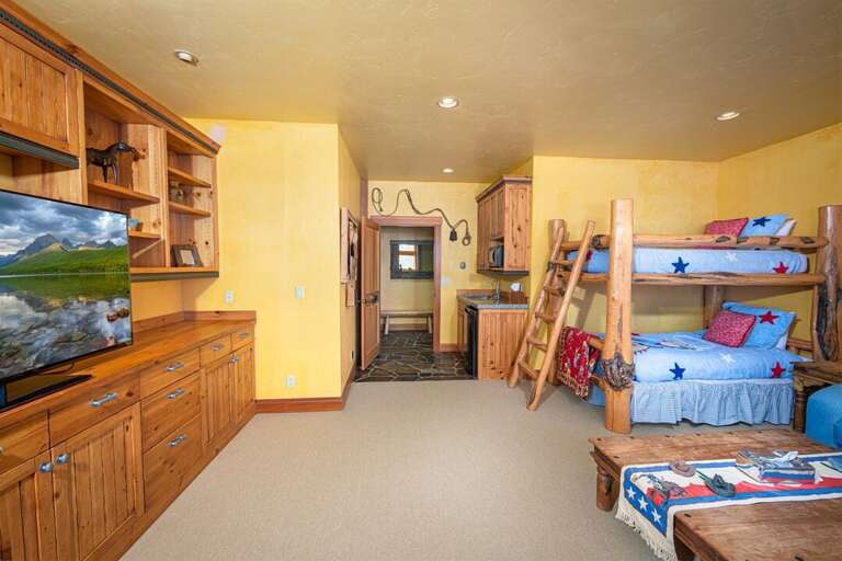 With a western cowboy theme, the bunk room is a special space for younger guests | Lower Level With a western cowboy theme, the bunk room is a special space for younger guests | Lower Level