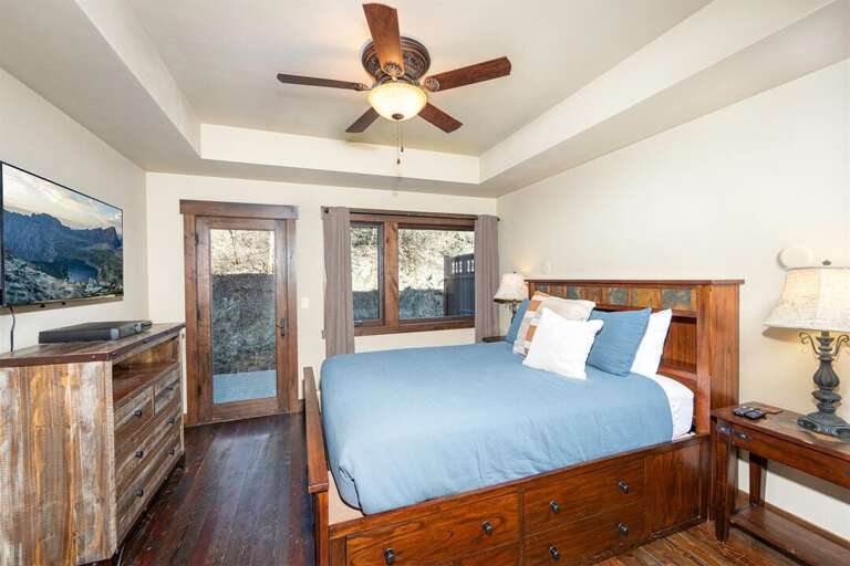 The master suite offers queen bed, private patio, private television, and ensuite with walk-in shower | Main Level