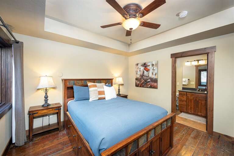 The master suite provides a private retreat after a day of adventure | Main Level