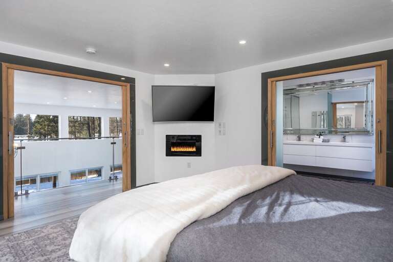 Enjoy a Movie in Bed by the Fireplace | Upper Level