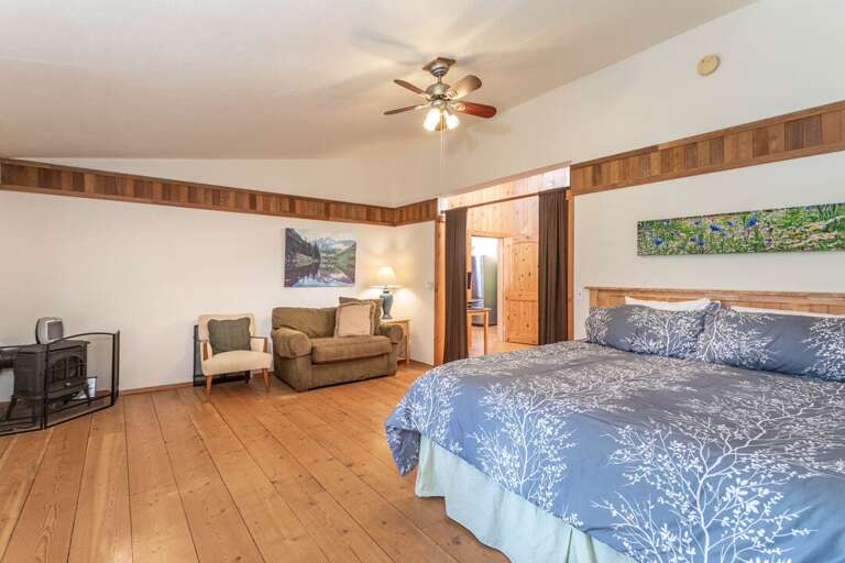 Get comfy in the king-sized bed | Main Level - The Great House Get comfy in the king-sized bed | Main Level - The Great House