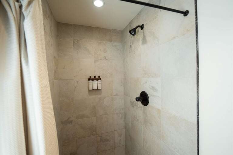 The main floor shower offers spa-quality bath products | Main Level