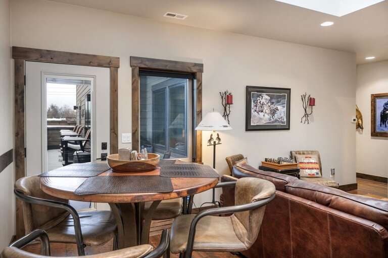 Access to the deck with Outdoor Seating and a Grill | Main Level