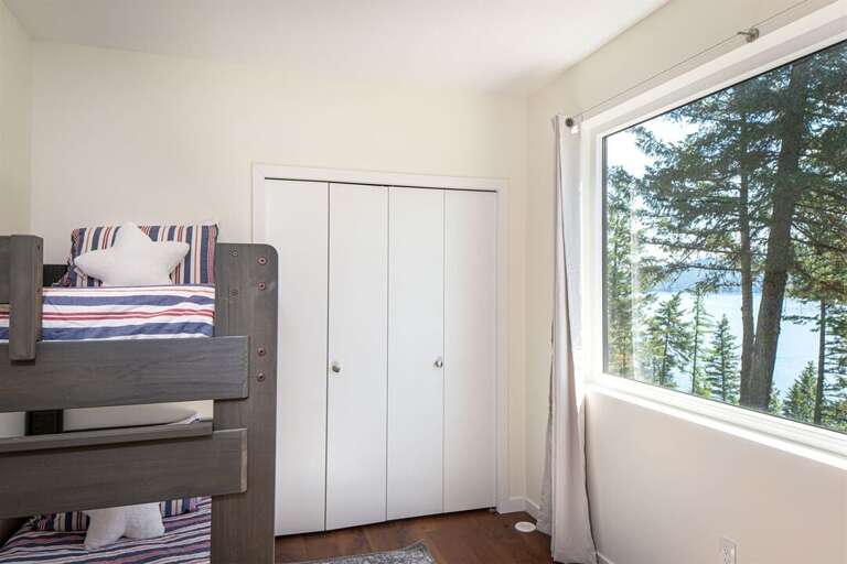 Each bedroom offers breathtaking views of Whitefish Lake | Upper Level