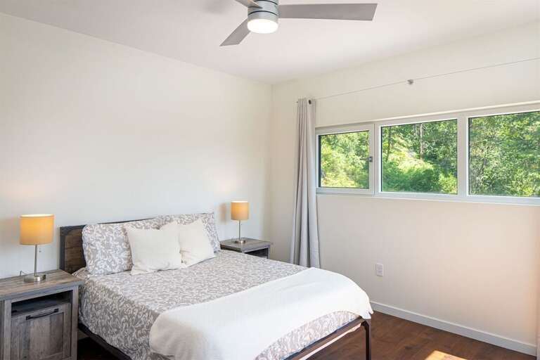 This bedroom offers a queen size bed | Main Floor