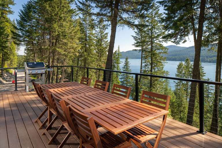 Dine al fresco in the fresh mountain air with incredible views of Whitefish Lake | Exterior