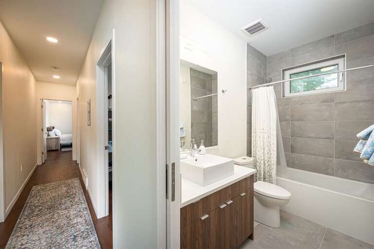 The guest bath serves the twin bunk room and queen bedroom | Upper Level