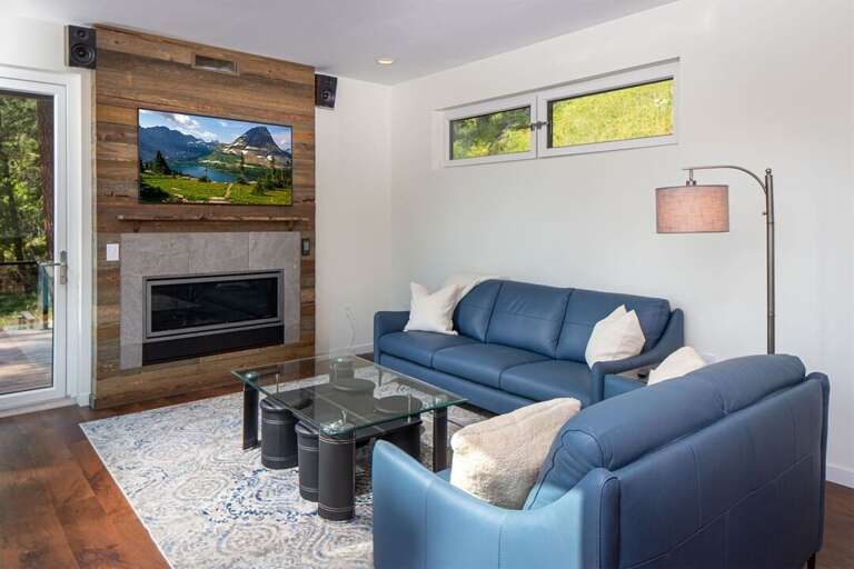The living room has a gas fireplace, flat screen television & walk-out access to the main patio | Main Floor