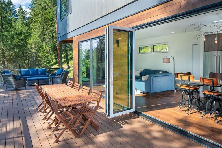 The living spaces expand to the main patio with additional seating, grill & private hot tub | Main Floor