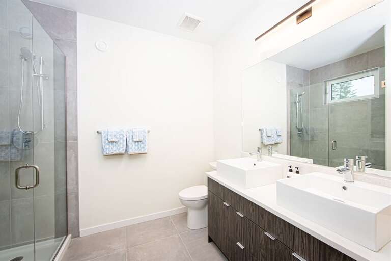 The master bathroom offers walk in shower & double vanity | Upper Level
