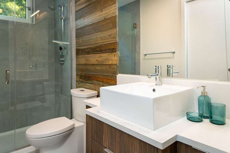 The second floor guest bathroom beautifully integrates modern and rustic aesthetic | Main Floor