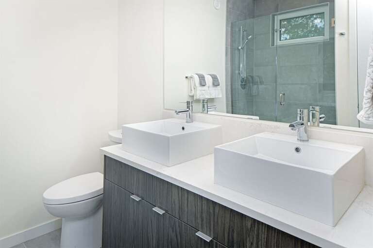 The master ensuite offers double vanity & beautiful walk-in shower | Upper Level