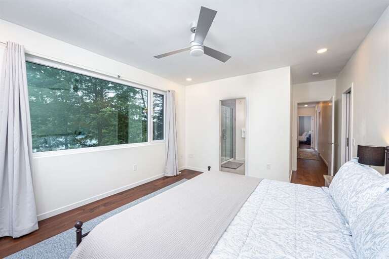 The master suite offers private patio, walk in closet, and ensuite with walk in shower | Upper Level