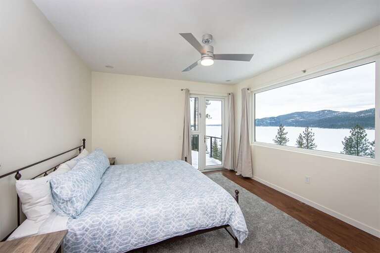 Relax & recharge in the treetop master suite featuring king bed, luxurious ensuite, walk-in closet & private patio | Upper Level