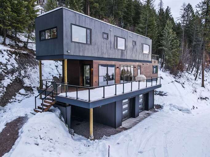 Tucked in the woods alongside Whitefish Lake, Larch Haus offers a peaceful retreat while being close to all the areas amenities | Exterior