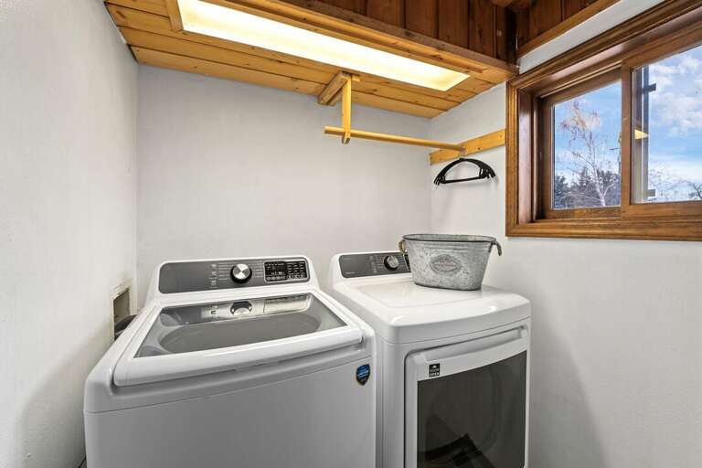 In-unit laundry with ample lighting | Main Level
