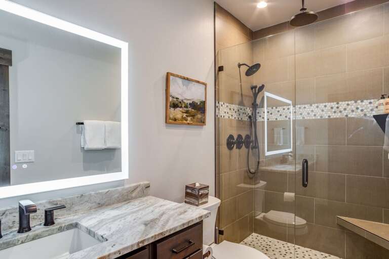 Third bathroom in-suite to the 3rd bedroom suite with king bed | Middle Level