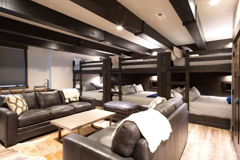 Custom built-in bunk room with 3 sets of king over king bunk beds, two couches, 75" TV & Sonos, 4-seat desk and 2 full bathrooms! | Middle Level