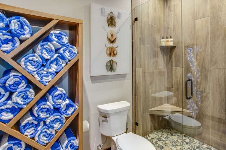 Enjoy getting ready for the day in this very modern bathroom with well lit mirror | Lower Level