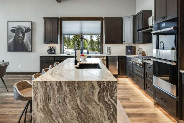 Gourmet kitchen with oversized refrigerator, dual dishwashers, gas stove, 5 bar seats and ice maker. | Upper Level