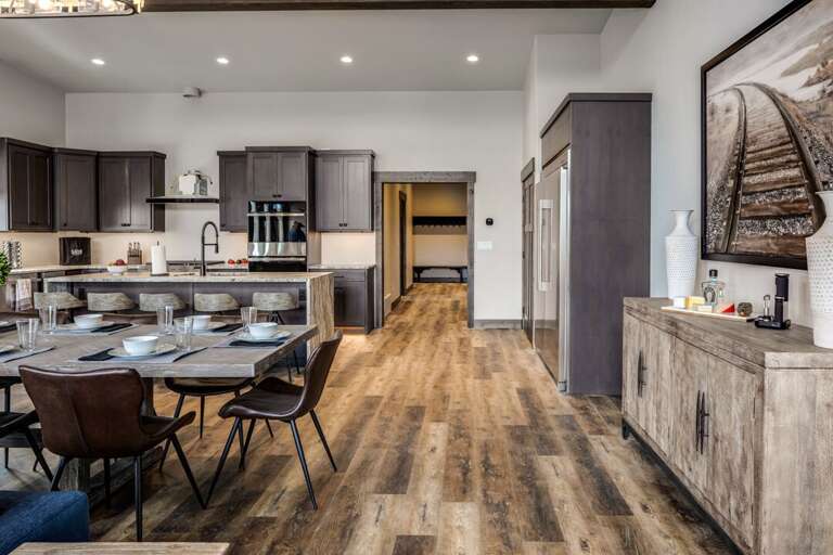 A well lit modern kitchen and dining area for entertaining | Upper Level