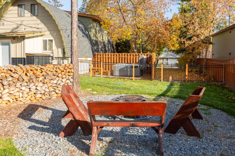 Backyard features a fire pit and hot tub!