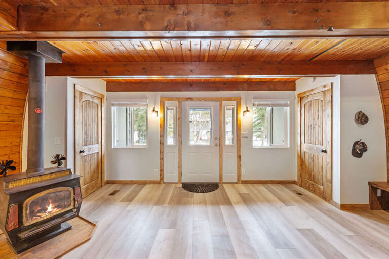 Front Entry into the Living Room with a Wood Stove | Main Level