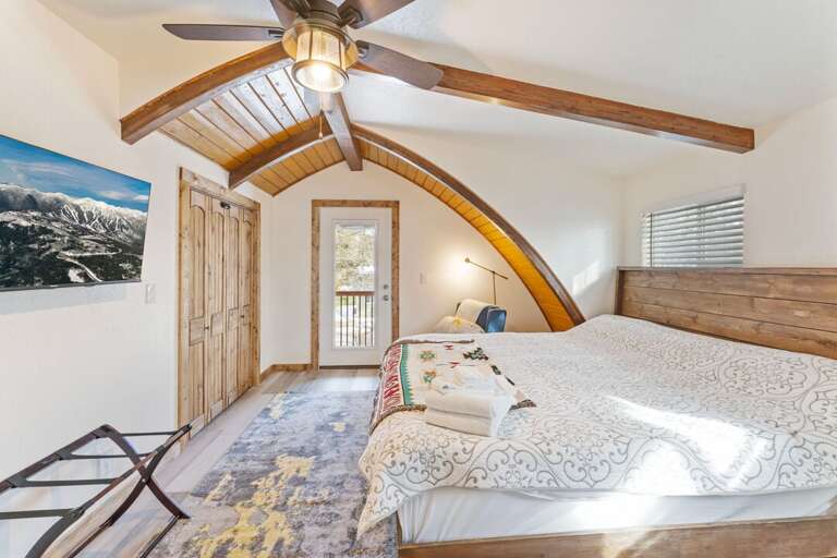 Upper Level Bedroom 1 with a California King Bed and Smart TV | Upper Level