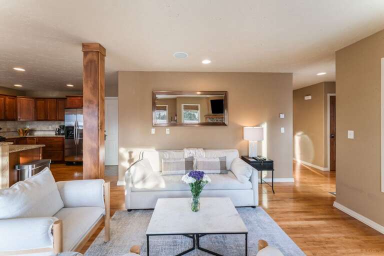 Ample lighting and offers an inviting ambiance for cozy evenings and lively conversations. | Main Level