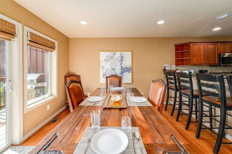 Dining Area with seating for six, hardwood floors and deck access | Main Level