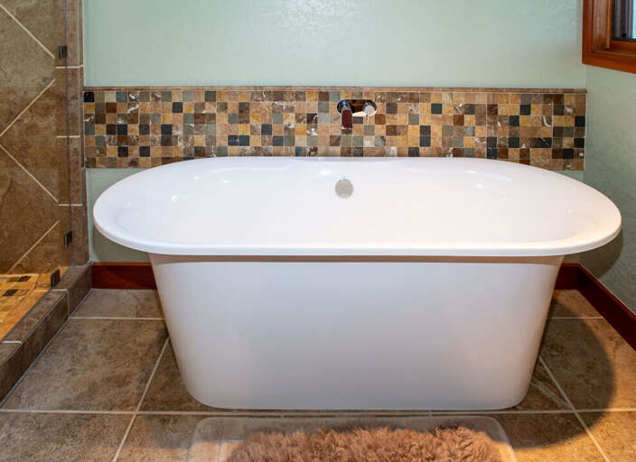 Large Soaking Tub and Separate Shower | Main Level