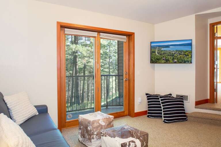 Lower Level Sitting Room with a Full-size Sleeper Sofa | Lower Level