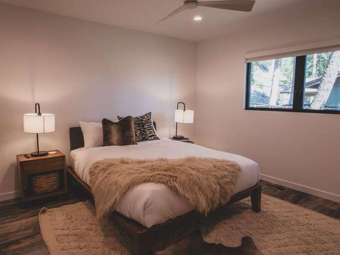 Enjoy a queen bed, private television, and adjoining ensuite | Main Level