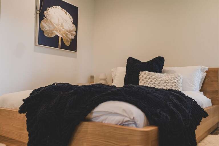 Enjoy the thoughtful use of texture and color in this beautifully styled space | Lower Level