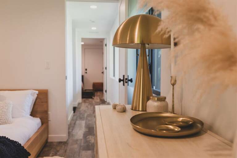The lower level queen rooms are joined by a hallway and share a full bathroom | Lower Level