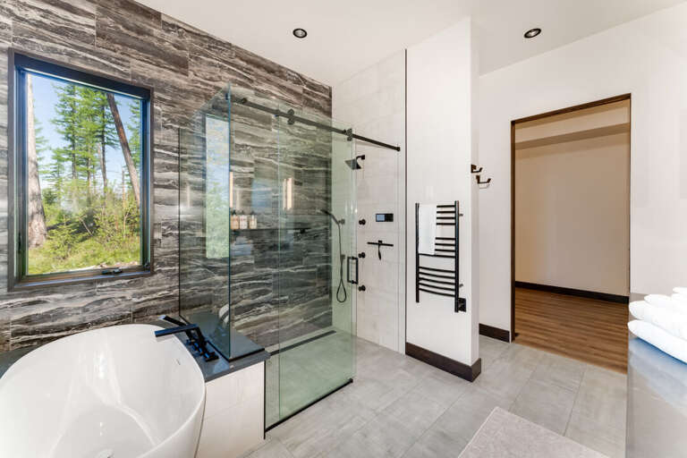 Master En Suite Shower with Two Shower Heads and Heated Towel Rack | Main Level Master En Suite Shower with Two Shower Heads and Heated Towel Rack | Main Level