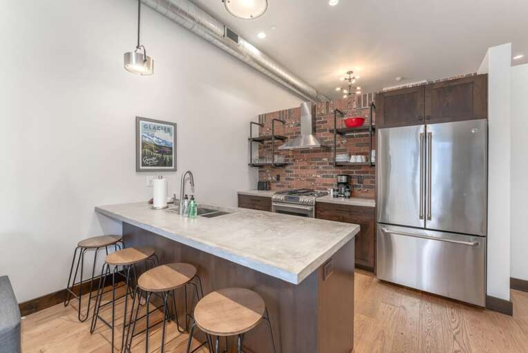 Kitchen island with bar seating for 4 | Main Level