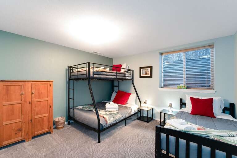 Twin-over-Queen bunkbed and twin-size bed | Lower Level Twin-over-Queen bunkbed and twin-size bed | Lower Level