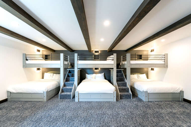Bedroom 2 (Middle Level)- Three Full Over Queen Bunk Beds, Desk Area, Sofa Seating and 2 En Suite Bathrooms! | Middle Level