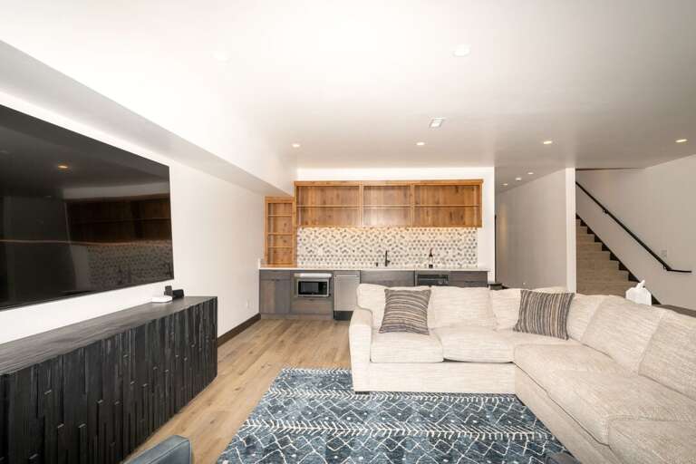 Lower Level Living Room with Queen Sleeper Sectional Sofa, 85" Smart TV and Pool Table | Lower Level