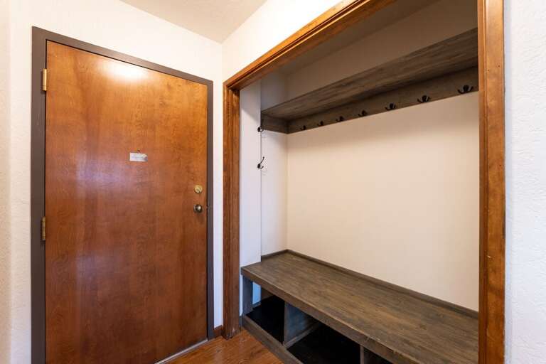 Interior Entrance with Bench and Coat Hooks | Main Level Interior Entrance with Bench and Coat Hooks | Main Level