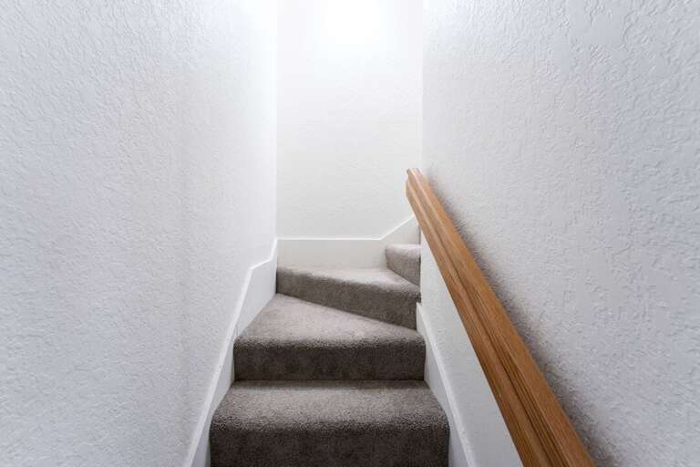 Sweeping Stairs Leading to Lower Level Bedrooms | Lower Level Sweeping Stairs Leading to Lower Level Bedrooms | Lower Level