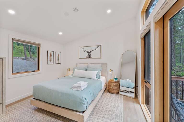 Bedroom 1 with a queen bed | Main Level Bedroom 1 with a queen bed | Main Level