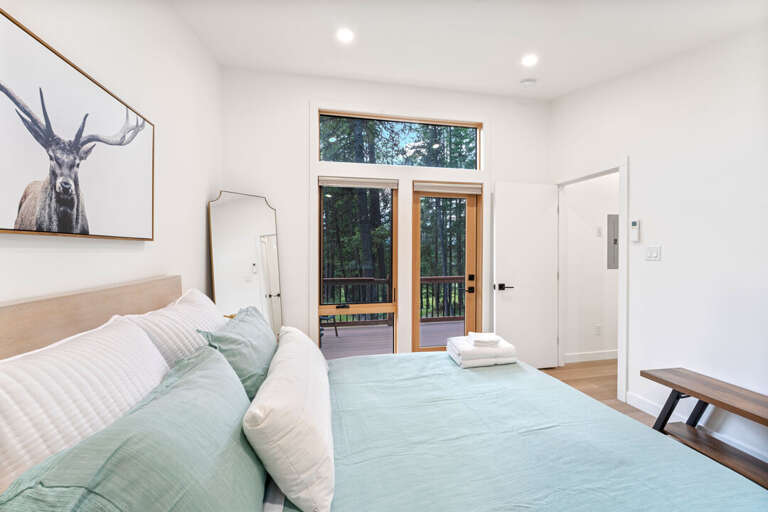 Bedroom 1 with deck access | Main Level Bedroom 1 with deck access | Main Level