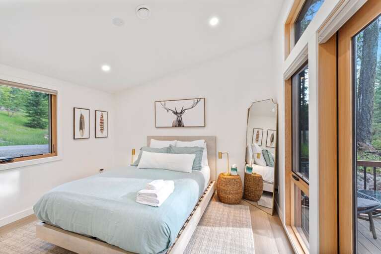 Bedroom 1 with a queen bed | Main Level Bedroom 1 with a queen bed | Main Level