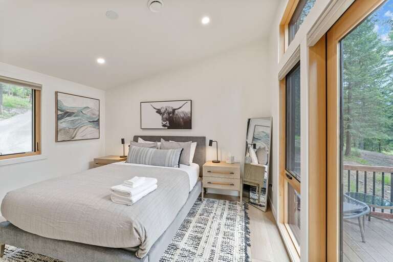 Bedroom 1 with a queen bed | Main Level