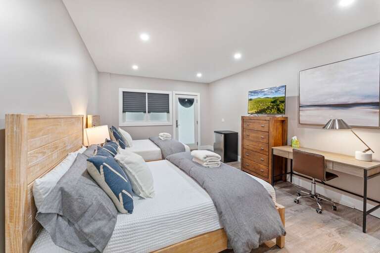 Exterior access only to Bedroom 5 with Two Full Beds and a Smart TV | Lower Level Exterior access only to Bedroom 5 with Two Full Beds and a Smart TV | Lower Level