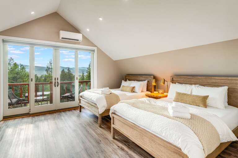 Upper Level | Bedroom 1 with Two Queen and a Private Balcony Upper Level | Bedroom 1 with Two Queen and a Private Balcony